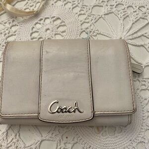 Vhtage coach wallet in pre lived condition. Clean with purple fabric